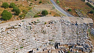 In this captivating aerial video, the remnants of the ancient city of Perge come into view, showcasing a stunning