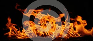 The captivating dance of flames in a dark setting. AI generated image