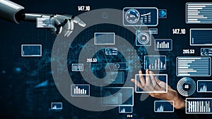 Futuristic Interaction Between Robot Hand and Human Hand Amidst Digital Data Visualization, Graphs, and Analytics in
