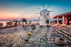 Captivating morning view of Potamitis Windmill. Colorful spring sunrise on Zakynthos island, Korithi location, Ionian Sea, Greece