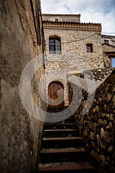 Captivating Photo of a Typical Italian House Made of Stone with an ancient door in Rocca Imperiale