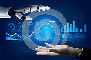 Futuristic interaction between human hand and robotic arm with data visualization graphics showcasing digital