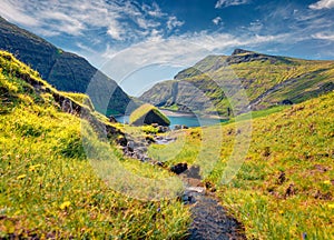 Captivating summer scene of Saksun village with typical turf-top houses.