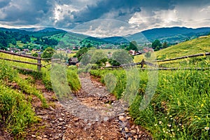 Captivating summer scene of Yasinya village with old country road, Ukraine, Europe