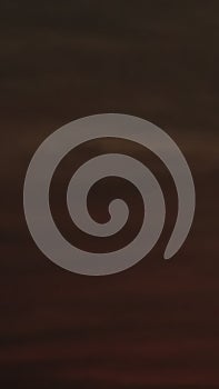 Dramatic sky at dusk with deep browns and oranges