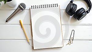 Essential Podcast Production Kit A Bright StudioReady Setup Featuring a Notebook Headphones Microphone and Paperclips