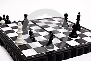 Captured king of chess on white background