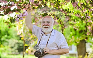 Capturing moments that captivate your heart. Photographer filming. Perfect frame. Pension hobby. Senior man photographer