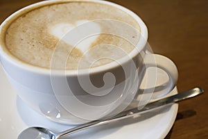 Capuchino coffee in a white cup