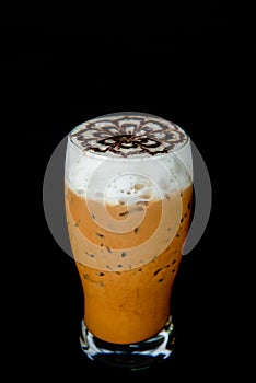 Capuchino and foam art on black