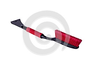 Car accessories for winter - plastic ice scrapers, red telescopic snow brushes with long handle on white background