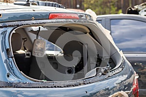 A car after an accident with a broken rear window. Broken window in a vehicle. The wreckage of the interior of a modern car after