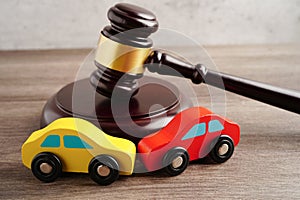 Car accident lawsuit and insurance, Judge hammer with car model