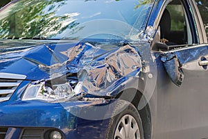 Car Accident. Left front of the blue car was damaged in a road accident