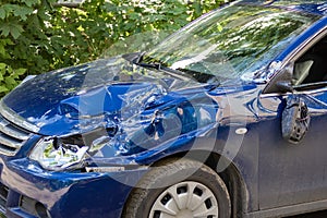 Car Accident. Left front of the blue car was damaged in a road accident