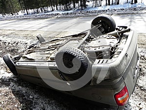 Car accident, overturned car. The accident happened in the winter on a slippery road.