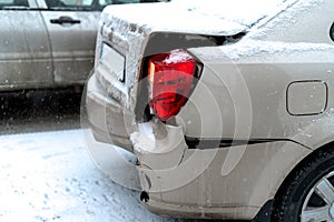 Car accident on the road in winter city