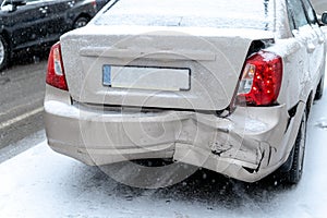 Car accident on the road in winter city