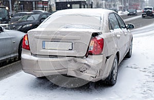 Car accident on the road in winter city