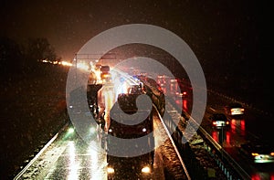 Car accident on slippery road at night during snowfall