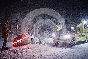 Car accident on slippery winter road at night