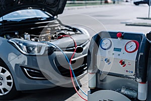 Car air condition ac repair service. Refill automobile ac compressor and checking auto conditioning system. Auto car photo