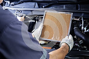 Car air conditioner system maintenance, Hand mechanic holding car air filter to check for clean dirty or fix repair heat have a