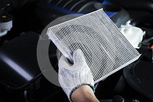 Car air conditioner system maintenance, Hand mechanic holding car air filter to check for clean dirty or fix repair heat have a