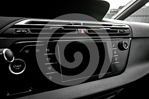 Car air conditioning panel on the luxury car console. Car climate control