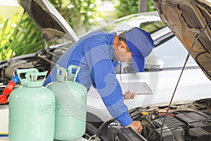Car Air Conditioning Repair, Technician checked car air conditioning system refrigerant recharge, Repairman check and fixed car