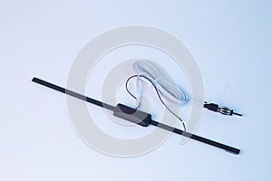 Car antenna inside the showroom on a white background