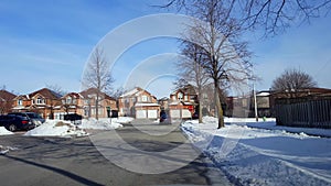 Car Approaches Stop Sign City Street Intersection and Turns Left.  Vehicle Driving Up to and Turning Left at Urban Road in Winter