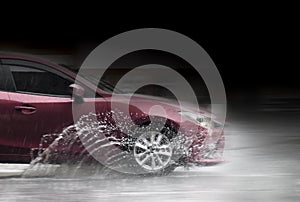 Car as it goes through flood water in motion blur. motion car rain big puddle of water spray from the wheels