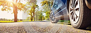 Car on asphalt road in summer