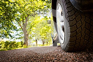 Car on asphalt road in summer