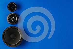 Car audio. Car speakers, bass speaker and midrange speaker lie in a row