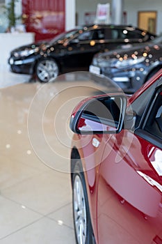 Car auto dealership. New cars at dealer showroom. Prestigious vehicles