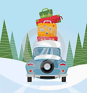 Car back View With stack of baggage on background of snow trees. Blue car with suitcases on the roof. Winter family traveling by