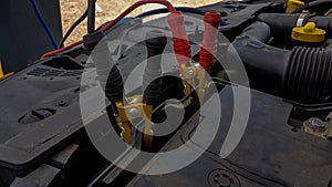 Car battery charging cords background