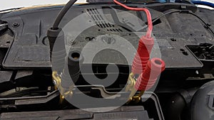 Car battery charging cords background