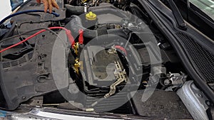 Car battery charging cords background