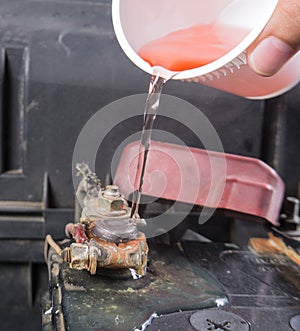 Car battery corrosion on terminal,Dirty battery terminals,Cleaning battery terminals by hot water.