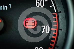 Car battery light in dashboard warning about problems. Vehicle panel with red indicator electricity icon and symbol.