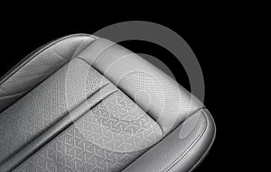 Car black leather interior. Part of black leather car seat details with white stitching. Interior of prestige car. Perforated