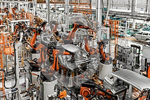 Car bodies are on assembly line. Factory for production of cars. Modern automotive industry. Electric car factory