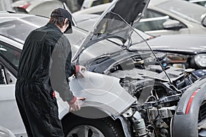 car body assembling before repair and painting in garage workshop