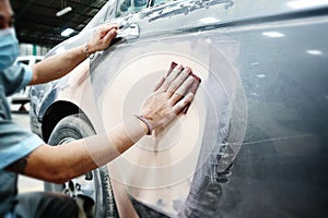 Car body work auto repair paint after the accident during the spraying