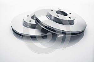 Car brake discs on white background