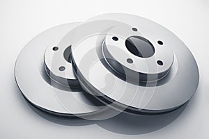 Car brake discs on white background