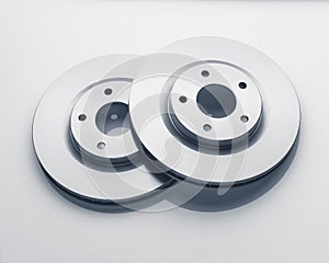 Car brake discs on white background